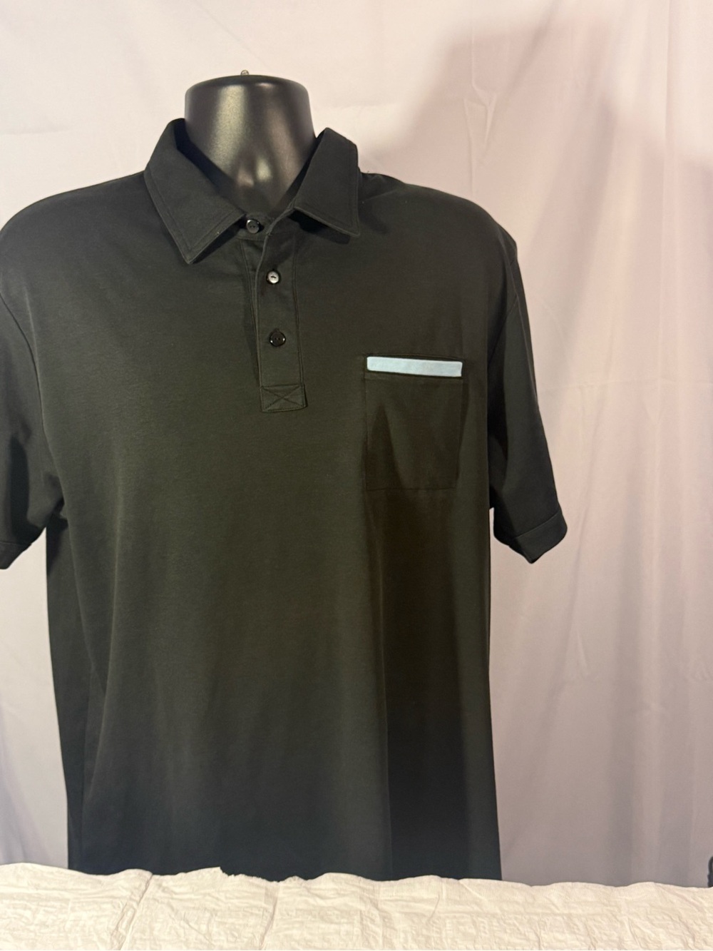 Travis Mathew Black Polo with Light Blue Pocket Trim